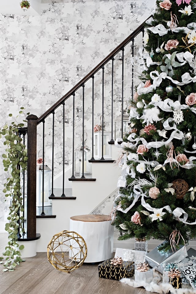 holiday tree and presents by staircase