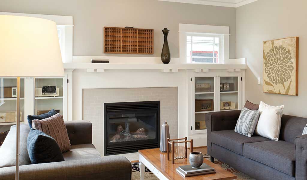 fireplace with built-in white shelving in a casual living room