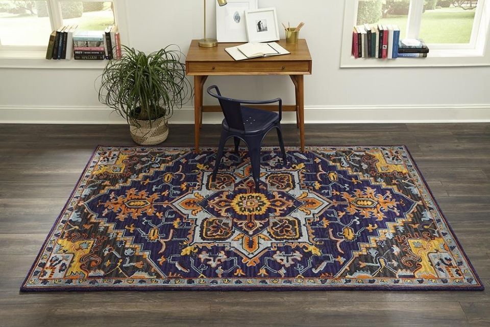 Navy and orange area rug by Momeni with pattern 