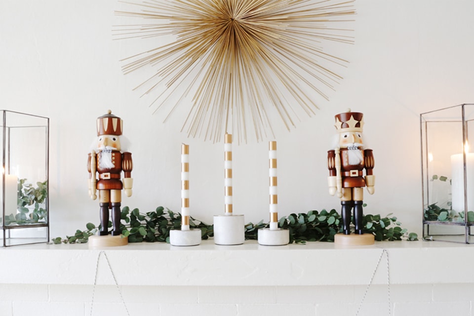 Nutcrackers and candles on holiday mantel