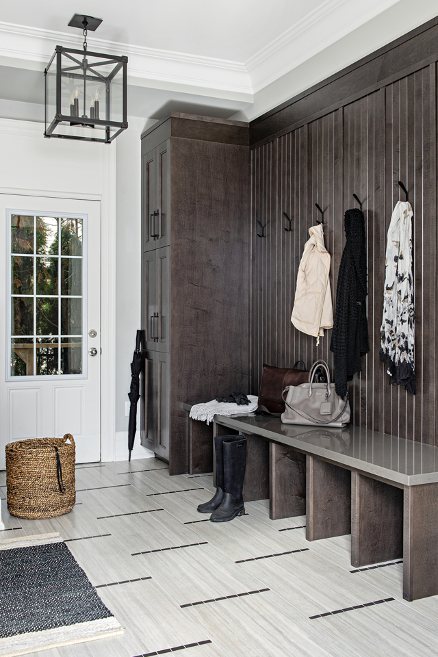 Entryway with box storage and hooks for jackets with tile 
