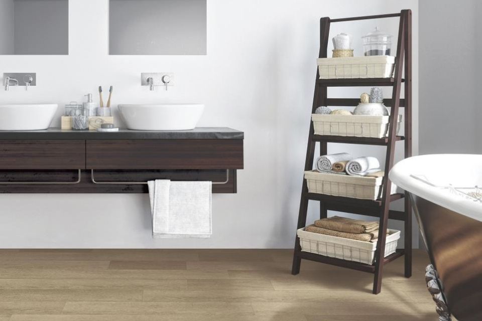 Luxury vinyl plank in bathroom with waterproof features and bathtub