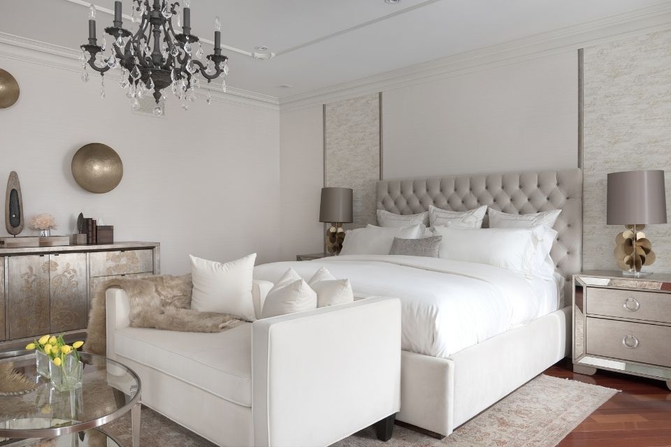 White bedroom design by Diana Rose Balanyuk with chic chandelier 