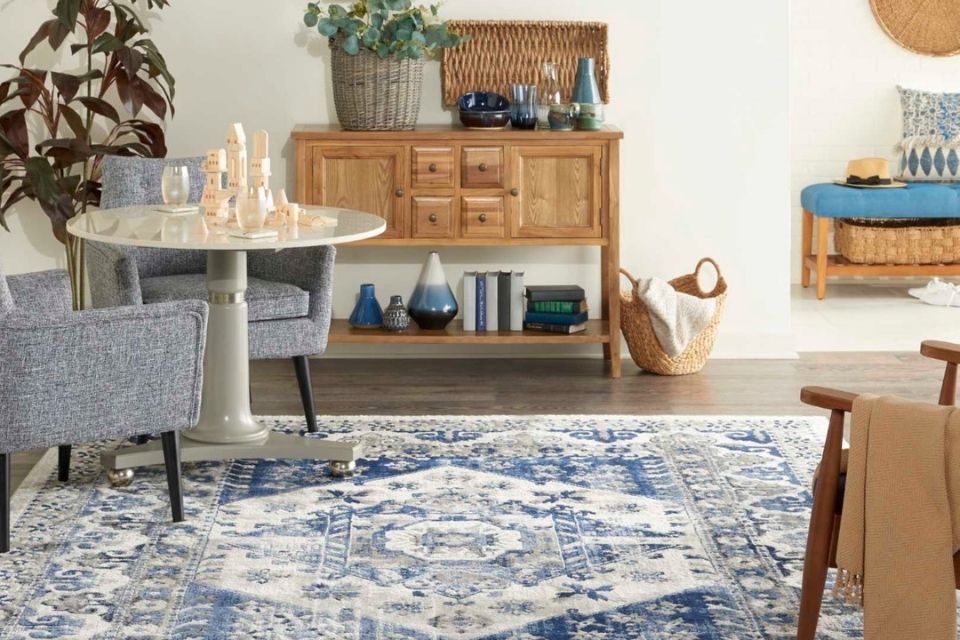 Blue and white area rug by Nourison in living room 