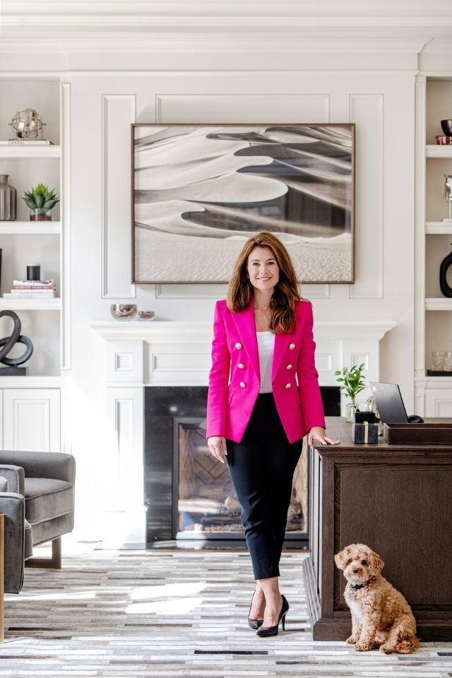 Kate Davidson interior designer with dog in large traditional office