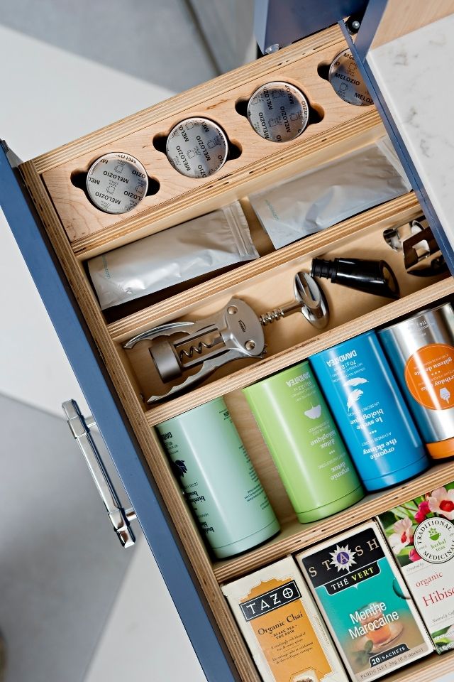 Organized drawer with tea and kitchen utensils 