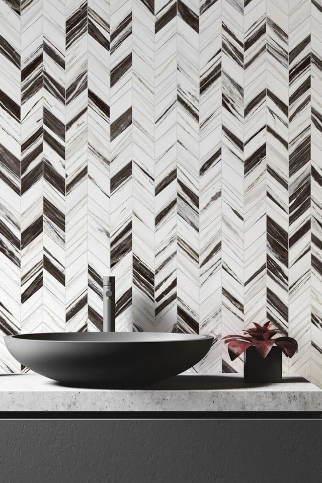 dramatic chevron mosaic tile bathroom backsplash in white and brown | Vertuo by Daltile