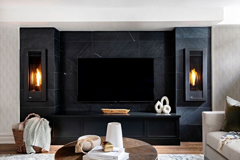 Large basement design with fireplace and black tile surround