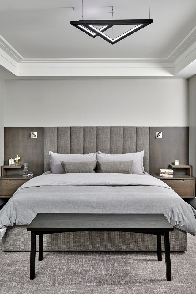 Minimalist bedroom with gray linens and simple decor