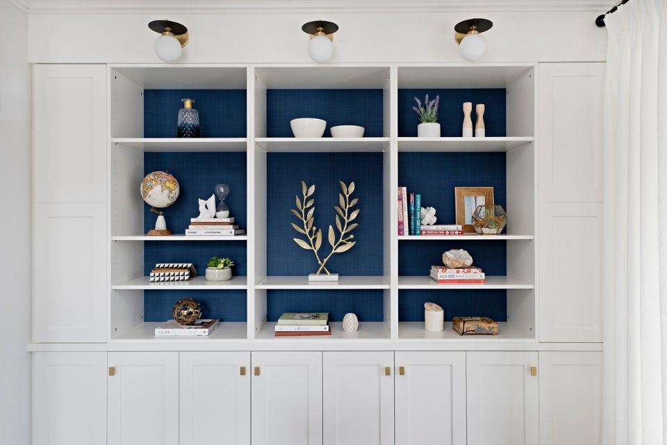 Blue behind built in bookshelf by Rebecca Hay white white cabinets 
