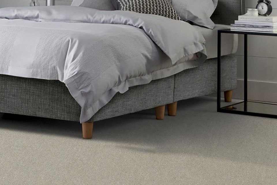 Neutral carpet installed in bedroom by Resista 
