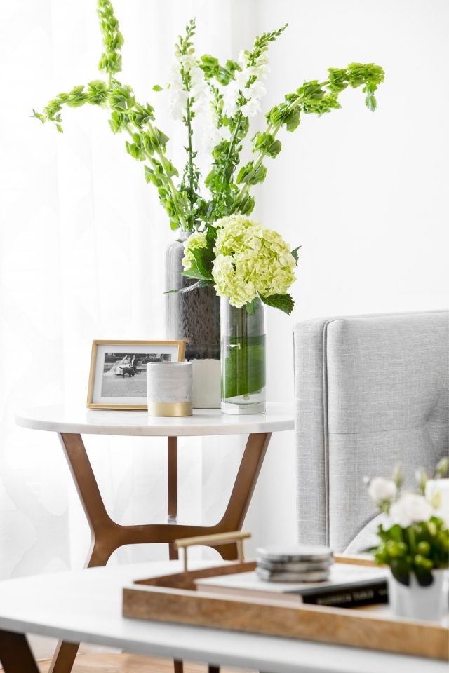 Side table with natural greenery for added earth vibes and natural design style