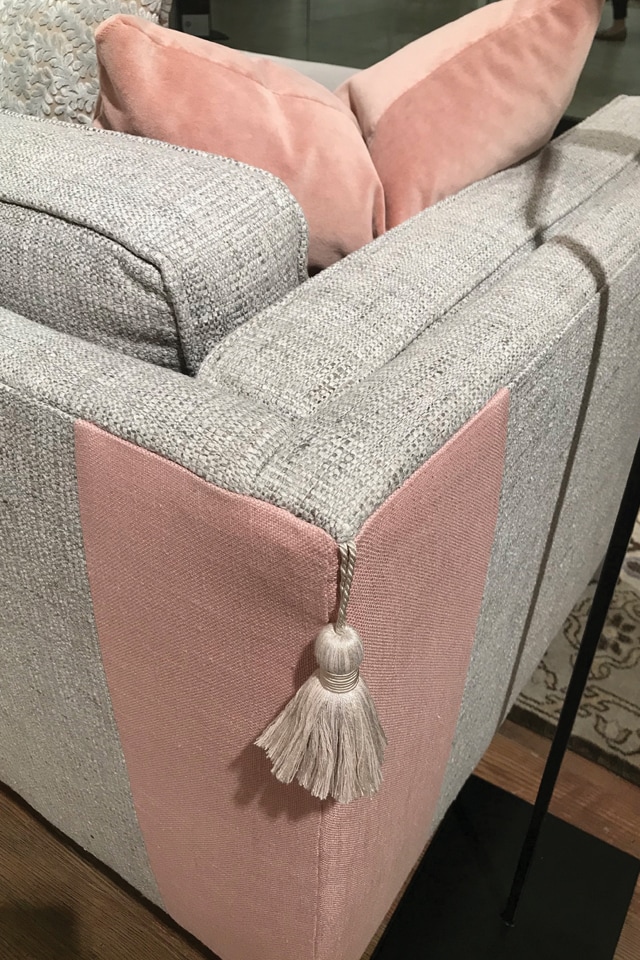 Norwalk Furniture details a sofa with a contrasting tassel
