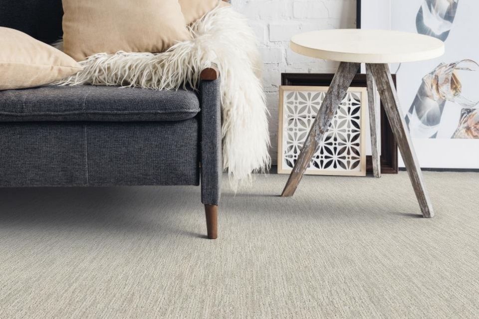 close up of beige patterned carpet in chic sitting area
