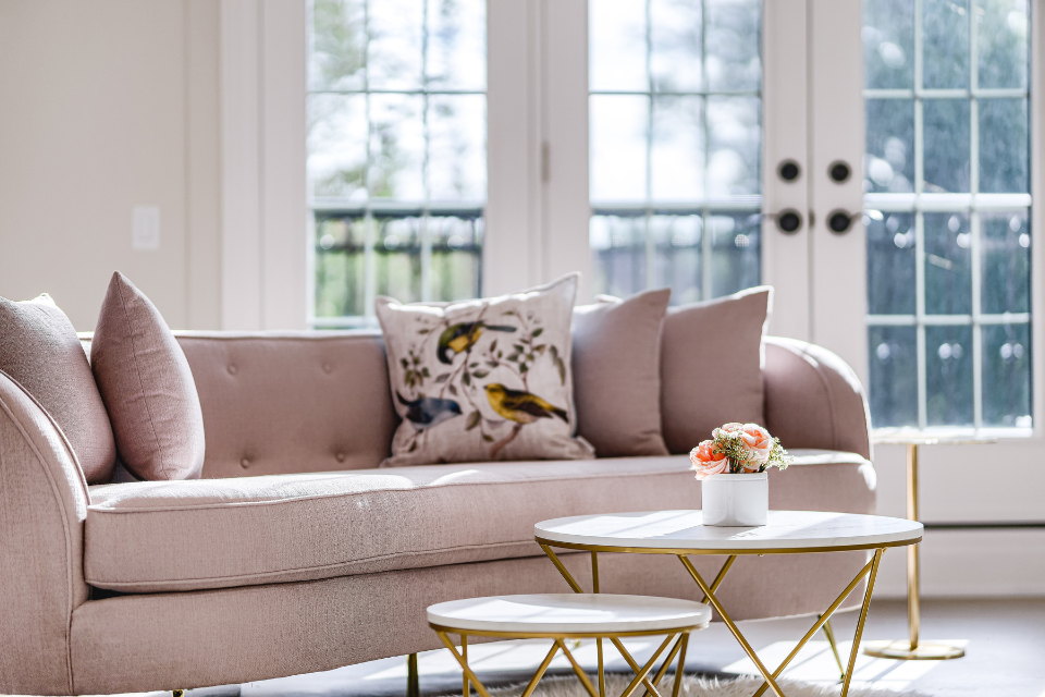 Blush pink sitting area with gold accents