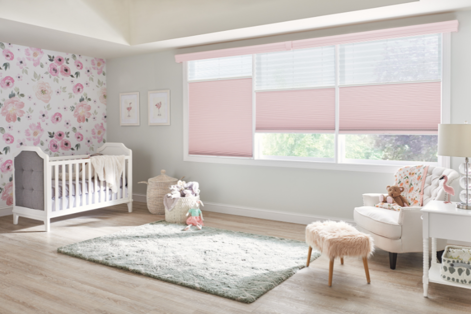 Children's bedroom with white oak flooring and blush pink decor 