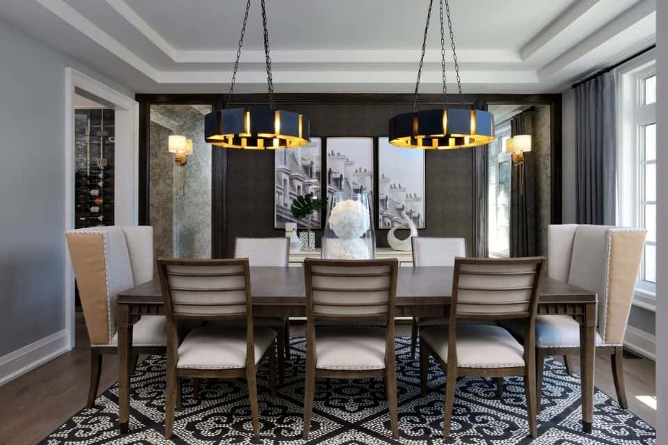 patterned large area rug in dining room beneath rectangular table