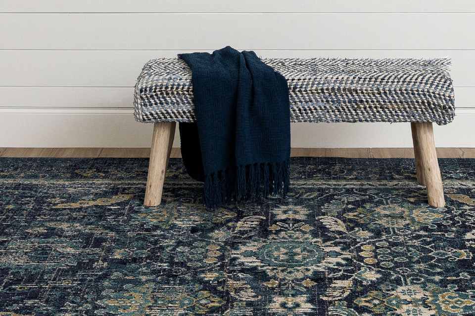floral blue area rug under bench