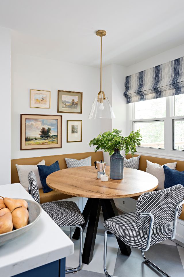blue and white breakfast nook with farmhouse style lighting