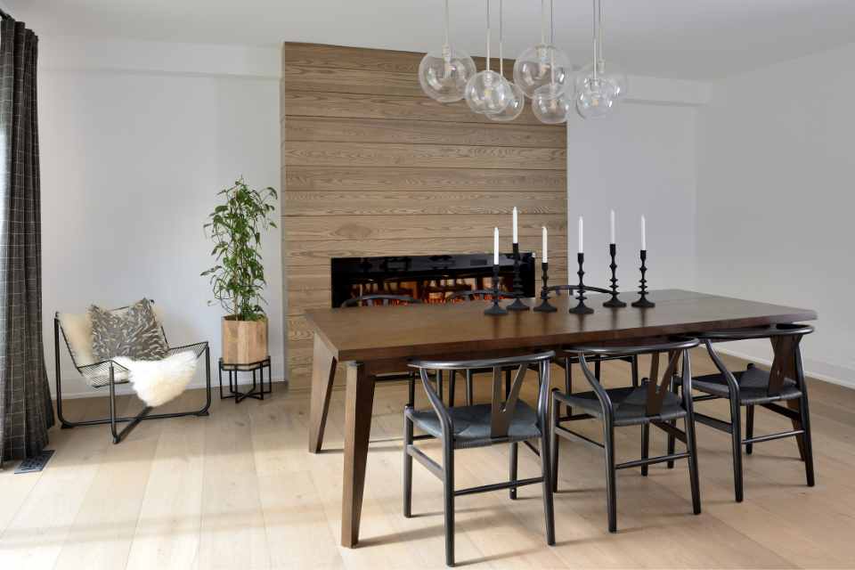designer dining room with fireplace and candles