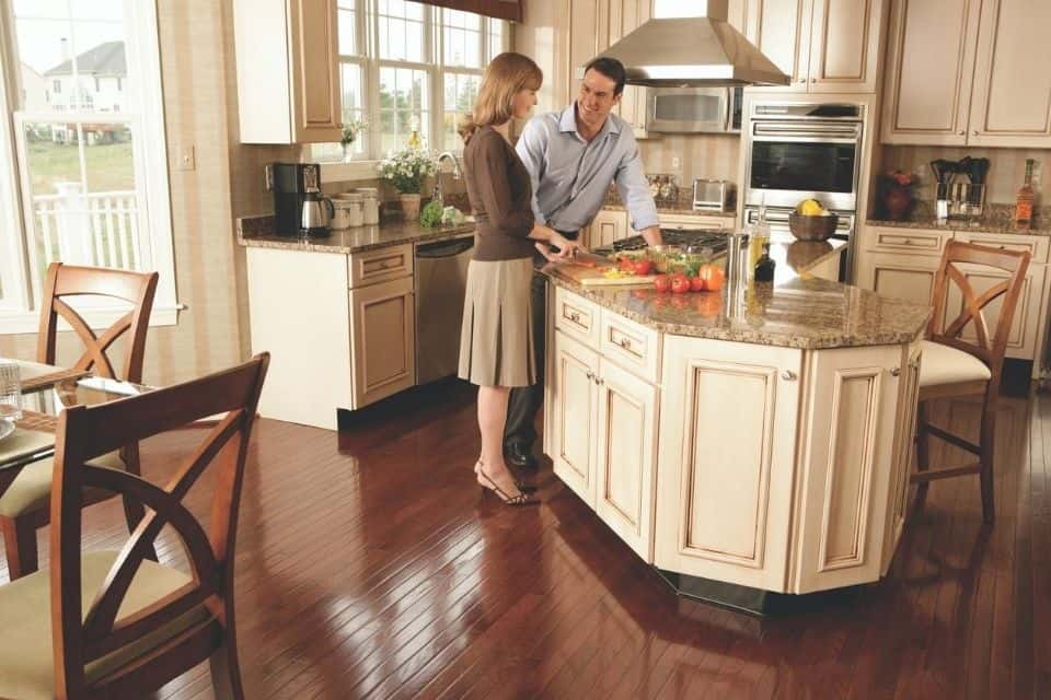 high gloss hardwood floor with cherry stain in traditional kitchen